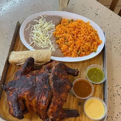 Pollo asado plate with rice, beans and house salsas