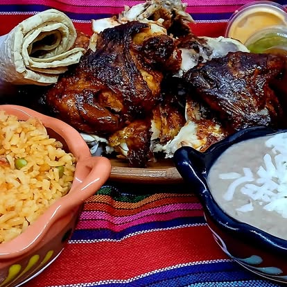 Pollo asado plate with rice and beans