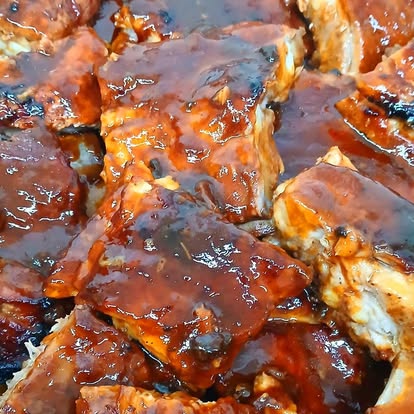 House BBQ ribs in a rich red sauce