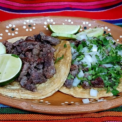 Carne asada street tacos with cilantro and onion