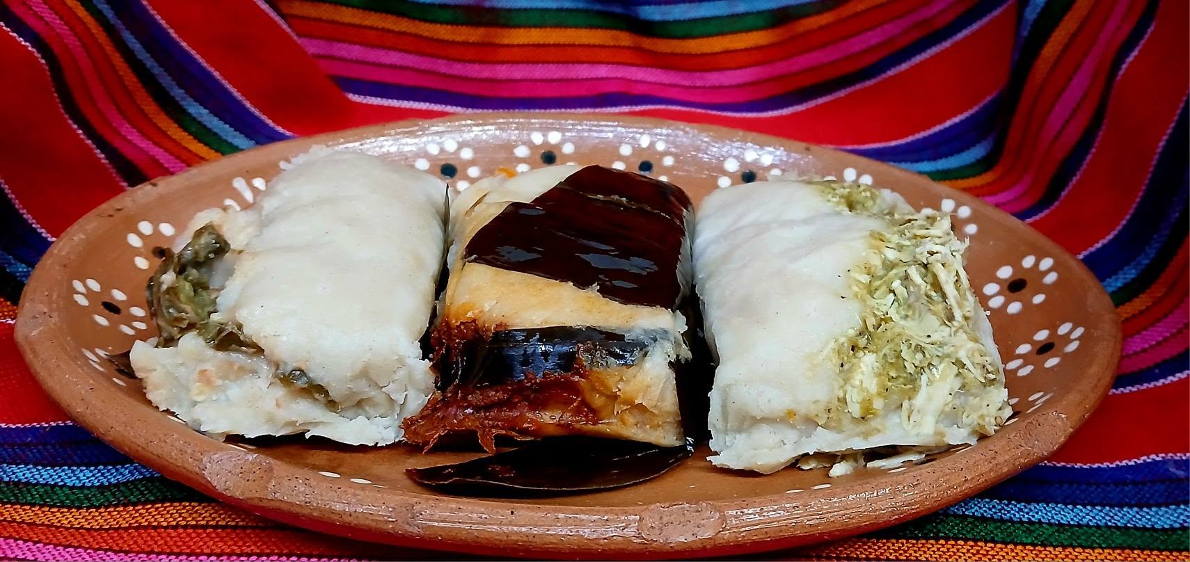 Handmade tamales on a clay platter